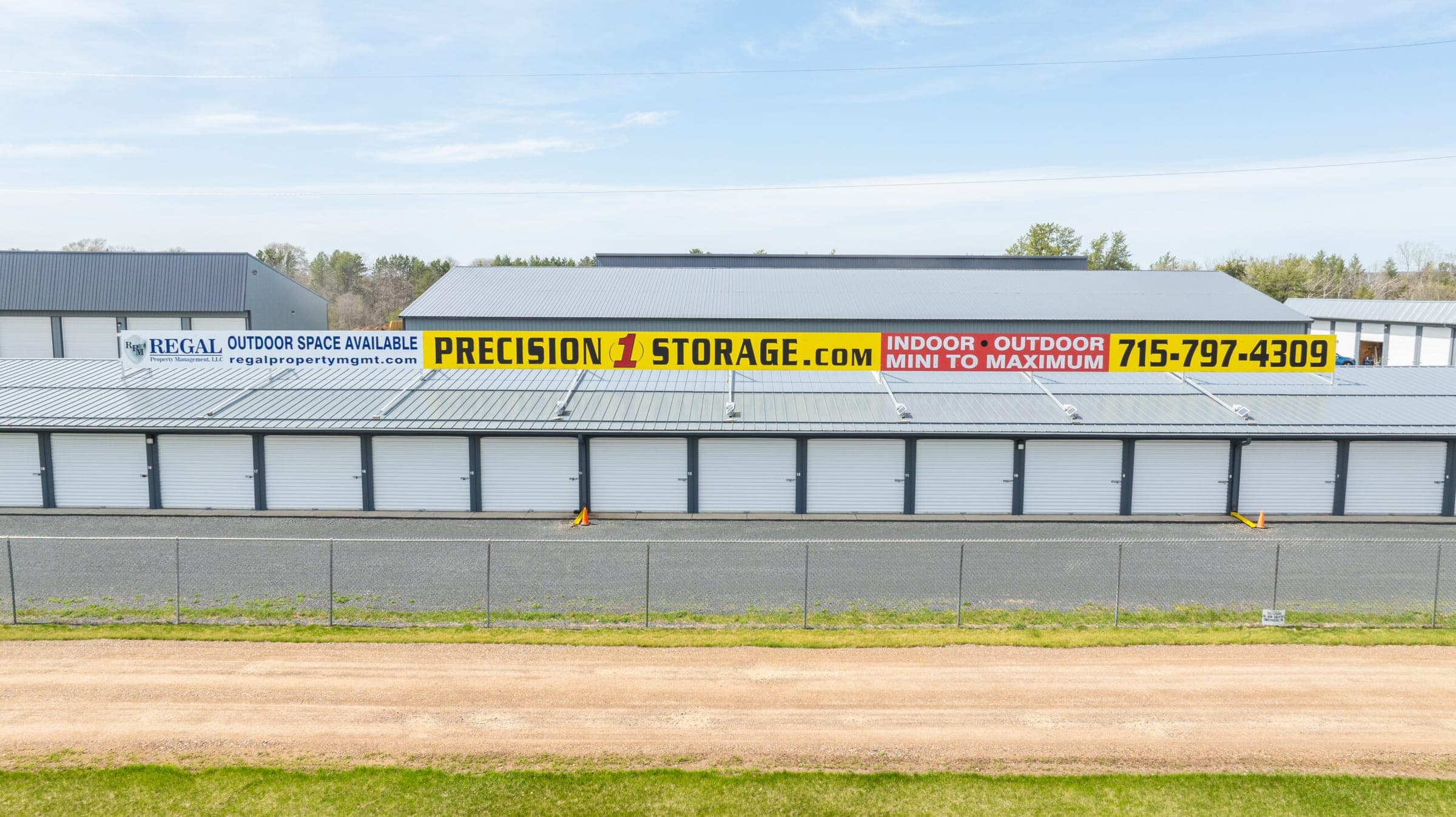 Aerial view of storage buildings with the Precision 1 Storage banner