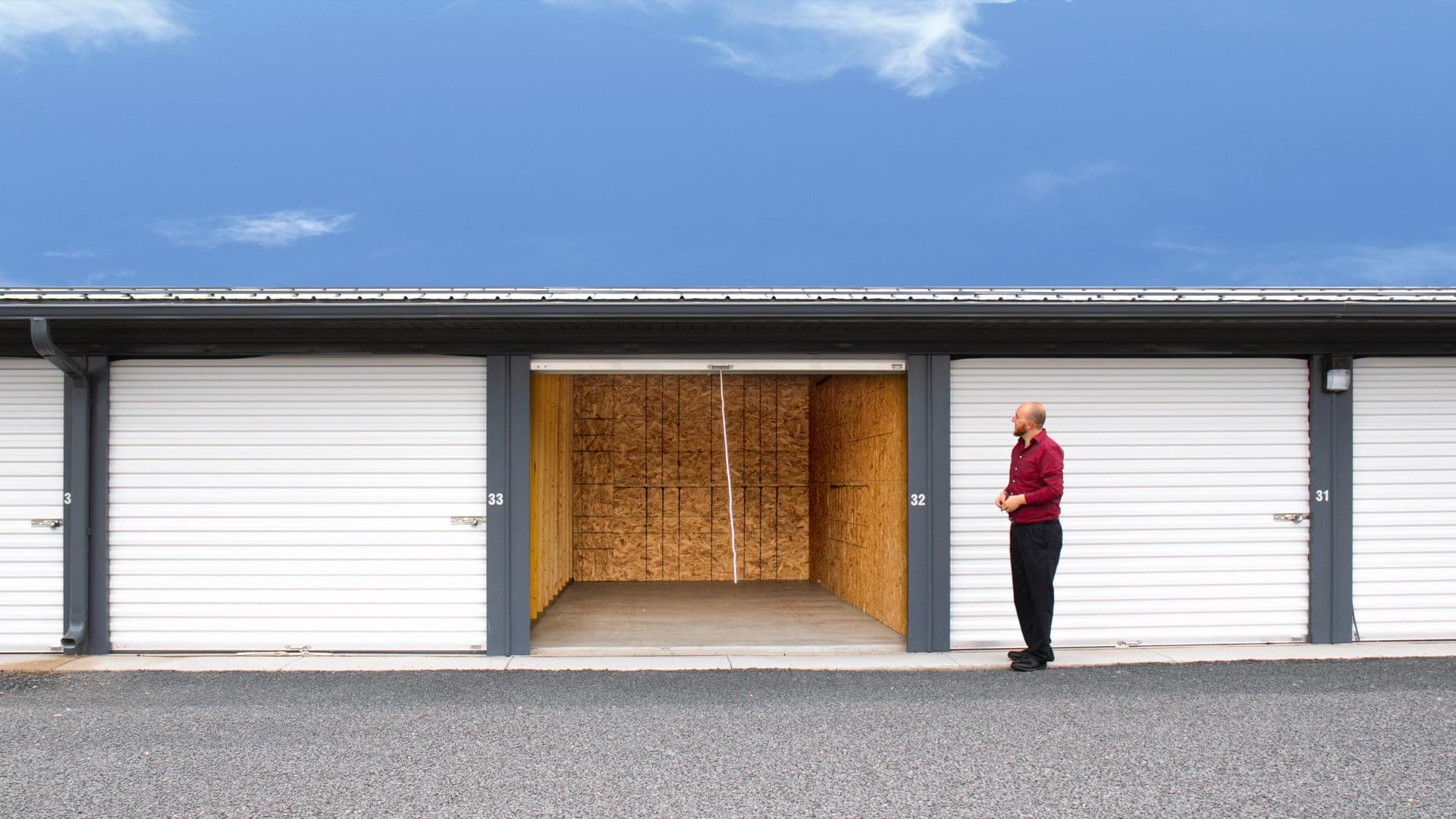 An open, empty drive-up storage unit ready for move-in